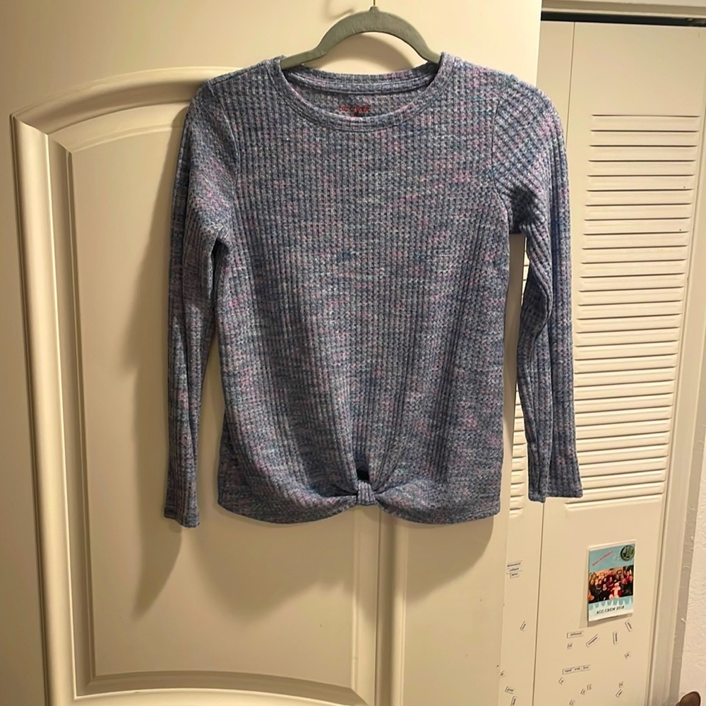 A super soft and cozy purple sweater. Light, not to heavy or thick.